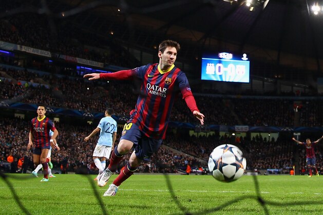 MANCHESTER, ENGLAND - FEBRUARY 18:  Lionel Messi of Barcelona celebrates scoring the opening goal from a penalty kick during the UEFA Champions League Round of 16 first leg match between Manchester City and Barcelona at the Etihad Stadium on February 18, 2014 in Manchester, England.  (Photo by Clive Brunskill/Getty Images)