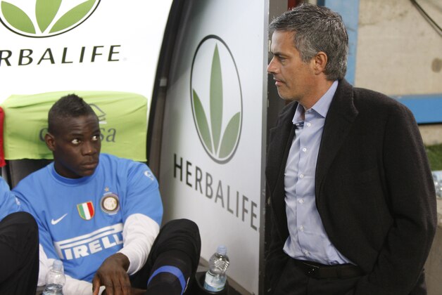 --  FILE -- In this photo taken on Friday, April 16, 2010 Inter Milan forward Mario Balotelli , left and coach Jose' Mourinho, of Portugal, look away from each other during a Serie A soccer match between Inter Milan and Juventus, at the San Siro stadium in Milan, Italy. 19-year-old forward Mario Balotelli, threw his jersey to the ground after being whistled at by fans and stormed angrily off the field while his teammates celebrated after winning a Champions league semifinal first leg match against Barcelona Tuesday, April 20, 2010. (AP Photo/Luca Bruno)