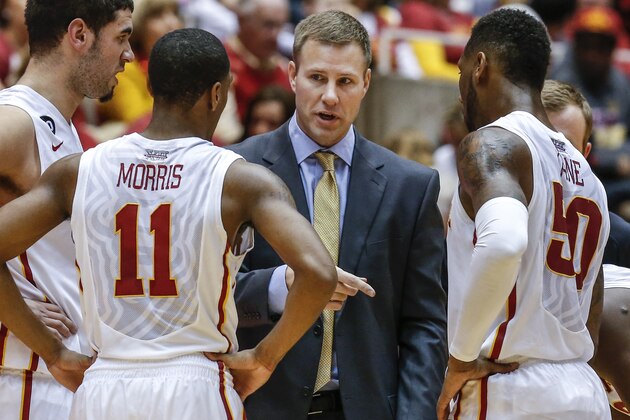 AMES, IA - FEBRUARY 15:   Head coach Fred Hoiberg of the Iowa State Cyclones talks with Georges Niang #31, Monte Morris #11 and DeAndre Kane #50 of the Iowa State Cyclones during a time out in the first half of play against Texas Tech at Hilton Coliseum on February 15, 2014 in Ames, Iowa. Iowa State defeated Texas Tech 70-64. (Photo by David Purdy/Getty Images)