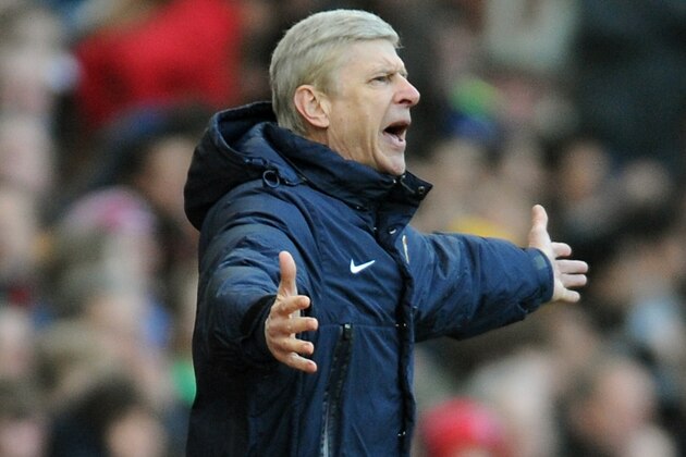 Arsenal manager Arsene Wenger shouts  during the English Premier League soccer match between Stoke City and Arsenal at Britannia Stadium in Stoke On Trent, England, Saturday, March 1, 2014. (AP Photo/Rui Vieira)