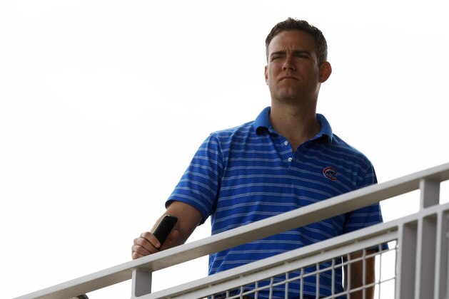 Chicago Cubs President of Baseball Operations, Theo Epstein watches from the tower during spring training baseball practice, Wednesday, Feb. 19, 2014, in Mesa, Ariz. (AP Photo/Rick Scuteri)