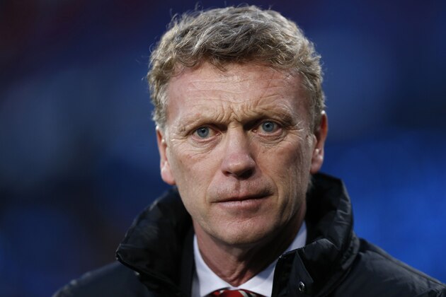 Manchester United's manager David Moyes arrives at the dugout before the start of their English Premier League soccer match against Crystal Palace at Selhurst Park, London, Saturday, Feb. 22, 2014. (AP Photo/Sang Tan)