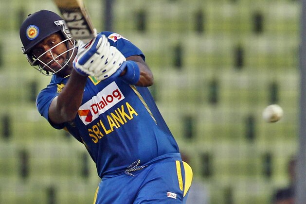 Sri Lanka’s Angelo Mathews plays a shot during the Asia Cup one-day international cricket tournament against Afghanistan in Dhaka, Bangladesh, Monday, March 3, 2014. (AP Photo/A.M. Ahad)