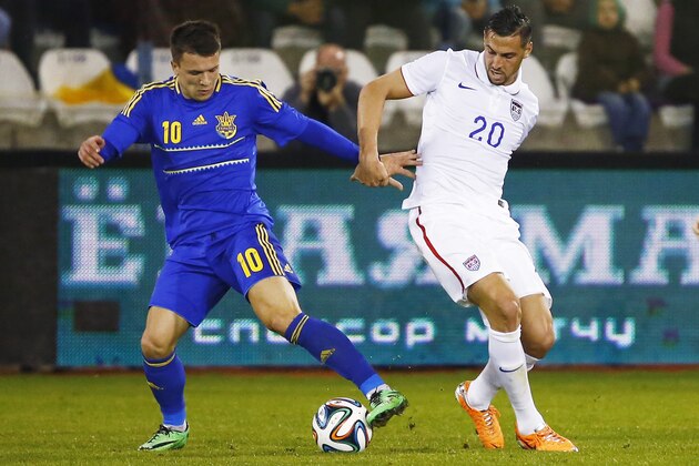 LARNACA, CYPRUS - MARCH 05:  Geoff Cameron (R) of the USA andYevhen Konoplianka of the Ukraine in action during the Ukraine v USA International Friendly  at Antonis Papadopoulos stadium on March 5, 2014 in Larnaca, Cyprus.  (Photo by Andrew Caballero-Reynolds/Getty Images)