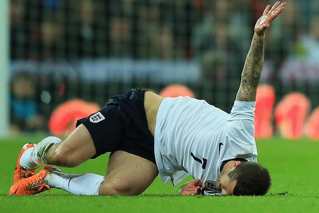 LONDON, ENGLAND - MARCH 05: Jack Wilshere of England grimaces as he goes to ground during the International Friendly match between England and Denmark at Wembley Stadium on March 5, 2014 in London, England.  (Photo by Richard Heathcote/Getty Images)