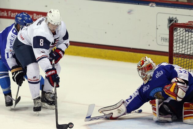 LAKE PLACID, NY - AUGUST 08: Joonas Korpisalo #32 of Team Finland gets in position to make a save on Hudson Fasching #8 of Team USA during the 2013 USA Hockey Junior Evaluation Camp at the Lake Placid Olympic Center on August 8, 2013 in Lake Placid, New York.  (Photo by Bruce Bennett/Getty Images)
