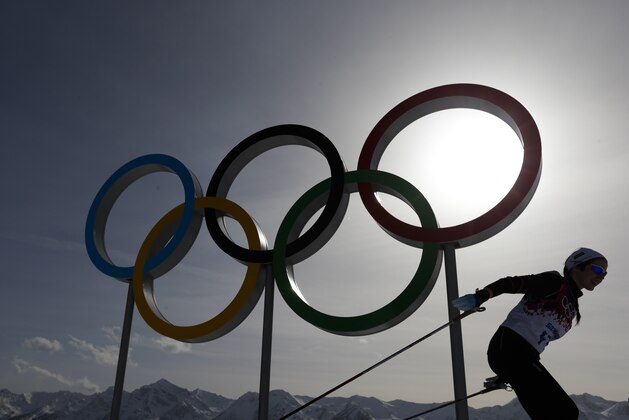 FILE - In this file photo dated Thursday, Feb. 20, 2014, a skier passes by the Olympic rings at the 2014 Winter Olympics, in Krasnaya Polyana, Russia. Overshadowed by the international crisis over Ukraine, Russia welcomes the sporting world back to Sochi this week for the Winter Paralympics that will be snubbed by some politicians and will struggle to match the successful Winter Olympics that ended less than two weeks ago in the Russian Black Sea resort. (AP Photo/Felipe Dana, FILE) FILE - In this file photo dated Thursday, Feb. 20, 2014, a skier passes by the Olympic rings at the 2014 Winter Olympics, in Krasnaya Polyana, Russia. Overshadowed by the international crisis over Ukraine, Russia welcomes the sporting world back to Sochi this week for the Winter Paralympics that will be snubbed by some politicians and will struggle to match the successful Winter Olympics that ended less than two weeks ago in the Russian Black Sea resort. (AP Photo/Felipe Dana, FILE)