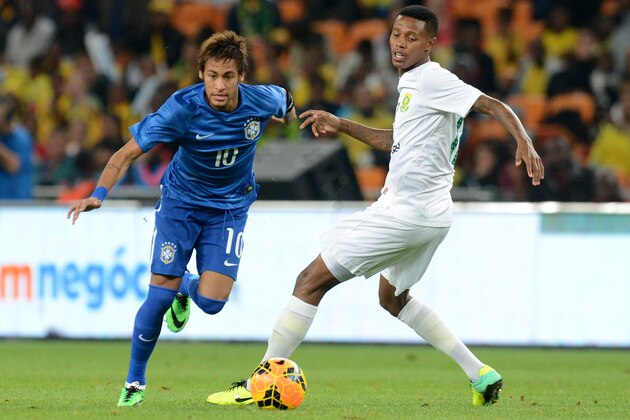 JOHANNESBURG, SOUTH AFRICA - MARCH 05:  Neymar of Brazil and Bongani Zungu of South Africa during the International Friendly match between South Africa and Brazil at FNB Stadium on March 05, 2014 in Johannesburg, South Africa. (Photo by Lefty Shivambu/Gallo Images/Getty Images)