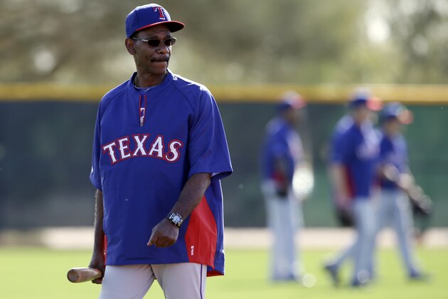 Texas Rangers manager Ron Washington watches position players during spring training baseball practice, Tuesday, Feb. 18, 2014, in Surprise, Ariz. (AP Photo/Tony Gutierrez)