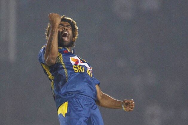Sri Lanka’s Lasith Malinga, celebrates taking the wicket of Pakistan’s Bilawal Bhatti during the opening match of the Asia Cup one-day international cricket tournament between them in Fatullah, near Dhaka, Bangladesh, Tuesday, Feb. 25, 2014. Sri Lanka won by 12 runs. (AP Photo/A.M. Ahad)