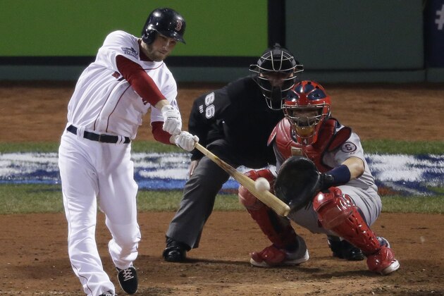 Boston Red Sox's Stephen Drew hits a home run during the fourth  inning of Game 6 of baseball's World Series against the St. Louis Cardinals Wednesday, Oct. 30, 2013, in Boston. (AP Photo/Charlie Riedel)