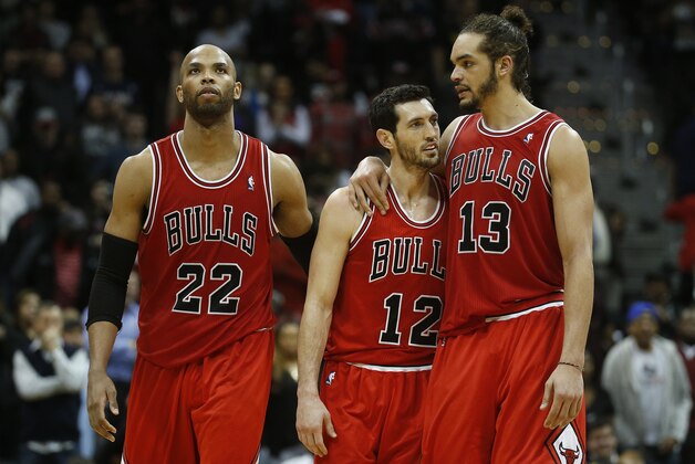 Chicago Bulls from left: Chicago Bulls power forward Taj Gibson (22), Chicago Bulls shooting guard Kirk Hinrich (12) ans Chicago Bulls center Joakim Noah (13) in the second half of an NBA basketball game  Tuesday, Feb. 25, 2014, in Atlanta. Chicago won 107-103. (AP Photo/John Bazemore)