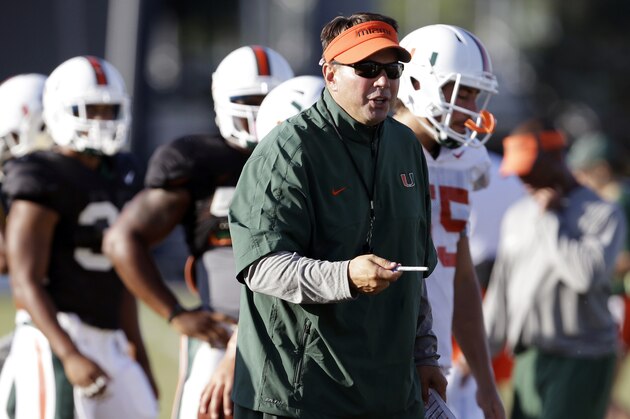 Miami head coach Al Golden watches as players do drills during an NCAA football practice, Wednesday, Aug. 7, 2013, in Coral Gables, Fla. (AP Photo/Lynne Sladky)