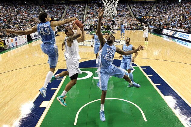 GREENSBORO, NC - MARCH 17: Trey McKinney Jones #4 of the Miami Hurricanes drives to the basket between teammates James Michael McAdoo #43 and Reggie Bullock #35 of the North Carolina Tar Heels during the finals of the Men's ACC Basketball Tournament at Greensboro Coliseum on March 17, 2013 in Greensboro, North Carolina. (Photo by Streeter Lecka/Getty Images) GREENSBORO, NC - MARCH 17: Trey McKinney Jones #4 of the Miami Hurricanes drives to the basket between teammates James Michael McAdoo #43 and Reggie Bullock #35 of the North Carolina Tar Heels during the finals of the Men's ACC Basketball Tournament at Greensboro Coliseum on March 17, 2013 in Greensboro, North Carolina. (Photo by Streeter Lecka/Getty Images)