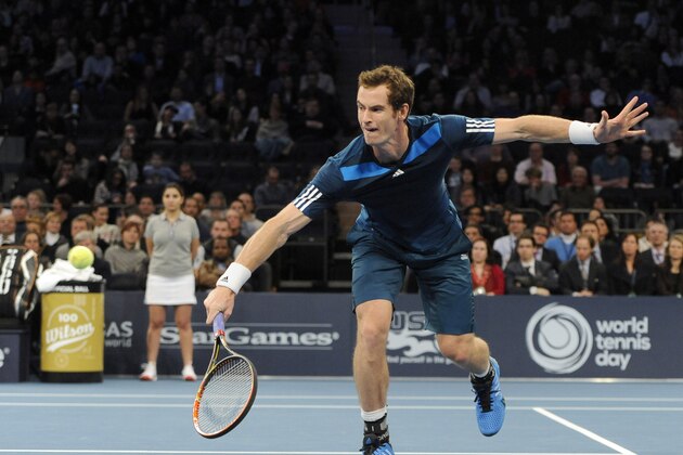 Andy Murray returns a shot against Novak Djokovic in the BNP Paribas Showdown Tennis Tournament on Monday, March 3, 2014, in New York. (AP Photo/Kathy Kmonicek)