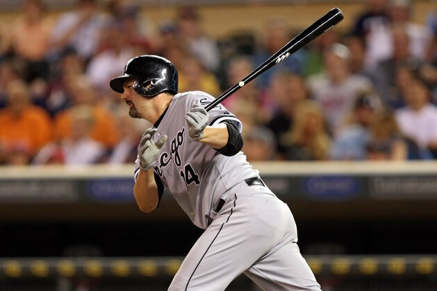 Jun 19, 2013; Minneapolis, MN, USA; Chicago White Sox first baseman Paul Konerko (14) hits a single in the eighth inning against the Minnesota Twins at Target Field. The Twins won 7-4. Mandatory Credit: Jesse Johnson-USA TODAY Sports