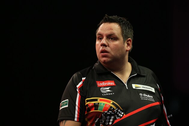 LONDON, ENGLAND - DECEMBER 18: Adrian Lewis of England during his first round match against Dennis Smith of England during the Ladbrokes.com World Darts Championship on Day Six at Alexandra Palace on December 18, 2013 in London, England. (Photo by Charlie Crowhurst/Getty Images)