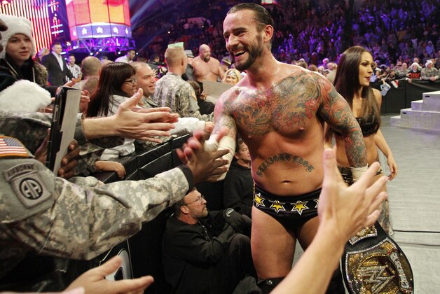 COMMERCIAL  IMAGE - In this photograph taken by AP Images for WWE, WWE Champion CM Punk thanks the troops for their service during WWE’s 9th annual