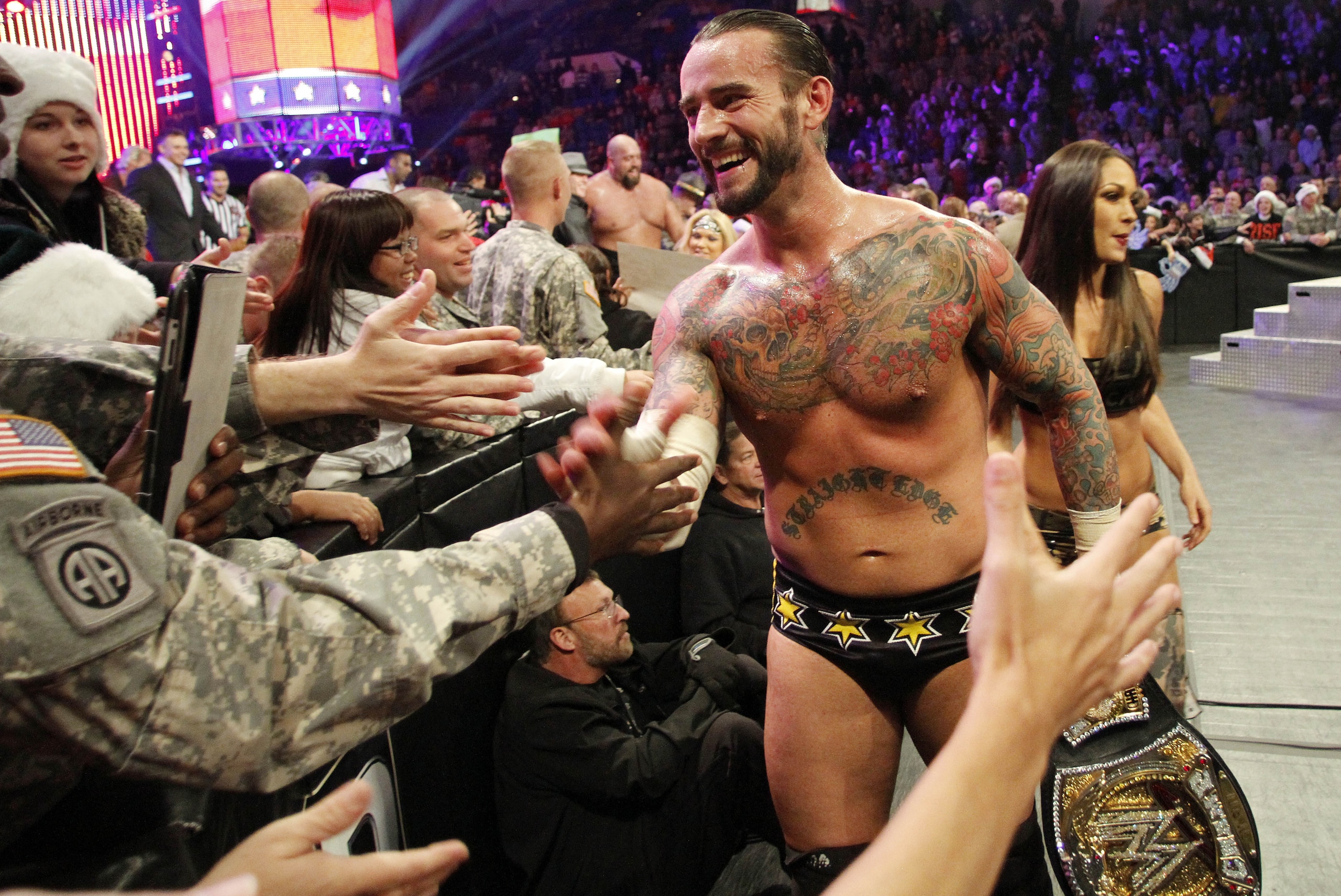 COMMERCIAL  IMAGE - In this photograph taken by AP Images for WWE, WWE Champion CM Punk thanks the troops for their service during WWE’s 9th annual