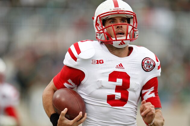 EAST LANSING, MI - NOVEMBER 03:  Taylor Martinez #3 of the Nebraska Cornhuskers runs for a second quarter touchdown while playing the Michigan State Spartans at Spartan Stadium Stadium on November 3, 2012 in East Lansing, Michigan. (Photo by Gregory Shamus/Getty Images)