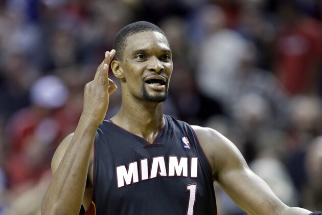 Miami Heat center Chris Bosh celebrates after sinking a three point shot with less than a second to go to win the game against the Portland Trail Blazers during an NBA basketball game in Portland, Ore., Saturday, Dec. 28, 2013. Bosh led the Heat in scoring with 37 points as they beat the Trail Blazers 108-107. (AP Photo/Don Ryan) Miami Heat center Chris Bosh celebrates after sinking a three point shot with less than a second to go to win the game against the Portland Trail Blazers during an NBA basketball game in Portland, Ore., Saturday, Dec. 28, 2013. Bosh led the Heat in scoring with 37 points as they beat the Trail Blazers 108-107. (AP Photo/Don Ryan)