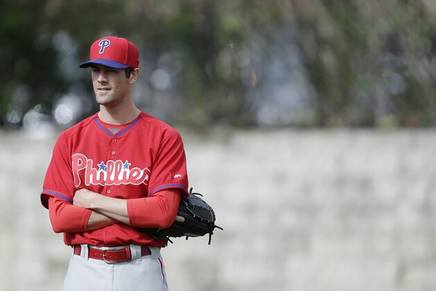 Philadelphia Phillies starting pitcher Cole Hamels looks on during spring training baseball practice Thursday, Feb. 13, 2014, in Clearwater, Fla. (AP Photo/Charlie Neibergall)