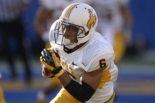 Oct 26, 2013; San Jose, CA, USA; Wyoming Cowboys wide receiver Robert Herron (6) catches a pass and runs for a touchdown during the first quarter against the San Jose State Spartans at Spartan Stadium. Mandatory Credit: Bob Stanton-USA TODAY Sports