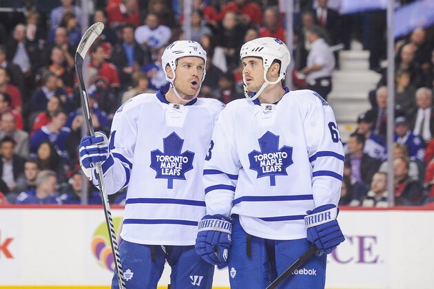 CALGARY, AB - OCTOBER 30: David Clarkson #71 and Dave Bolland #63 of the Toronto Maple Leafs confer between play  against the Calgary Flames during an NHL game at Scotiabank Saddledome on October 30, 2013 in Calgary, Alberta, Canada. (Photo by Derek Leung/Getty Images)