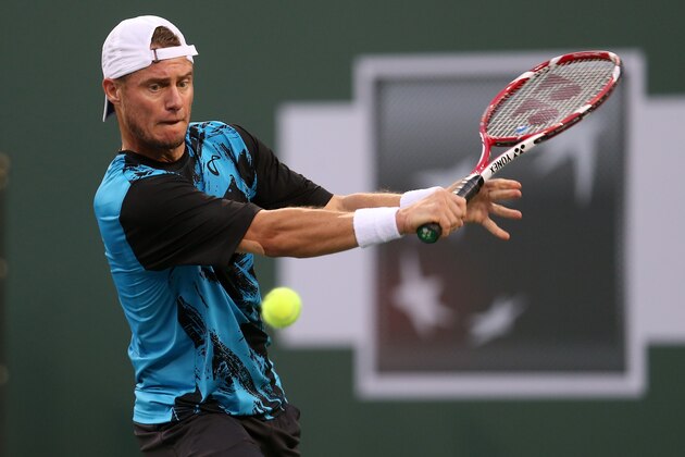 INDIAN WELLS, CA - MARCH 06:  Lleyton Hewitt of Australia hits a return to Matthew Ebden of Australia during the BNP Paribas Open at Indian Wells Tennis Garden on March 6, 2014 in Indian Wells, California.  (Photo by Stephen Dunn/Getty Images)