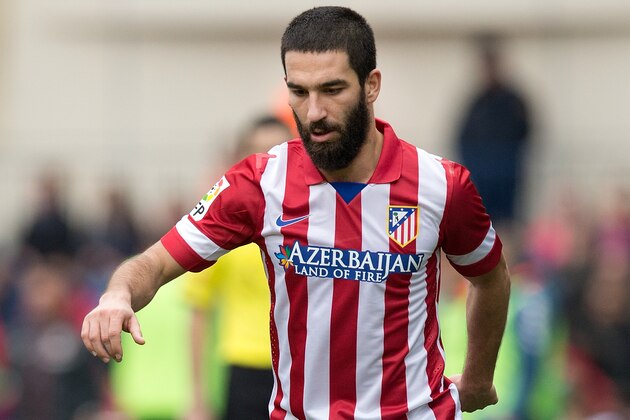 MADRID, SPAIN - FEBRUARY 15: Arda Turan of Atletico de Madrid controls the ball during the La Liga match between Club Atletico de Madrid and Real Valladolid CF  at Vicente Calderon Stadium on February 15, 2014 in Madrid, Spain.  (Photo by Gonzalo Arroyo Moreno/Getty Images)