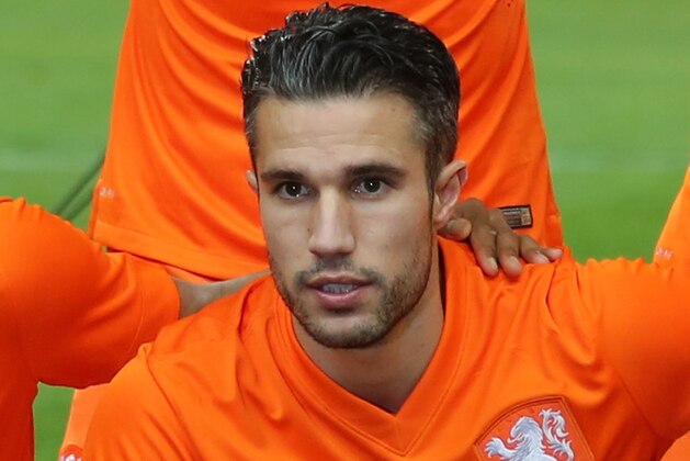 Netherlands team captain Robin Van Persie poses before the friendly soccer match between France and Netherlands at the Stade de France in Saint Denis, north of Paris, Wednesday March 5, 2014.(AP Photo/Remy de la Mauviniere)