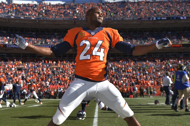 Denver Broncos cornerback Champ Bailey (24) warms up before the AFC Championship NFL playoff football game against New England Patriots in Denver, Sunday, Jan. 19, 2014. (AP Photo/Jack Dempsey)