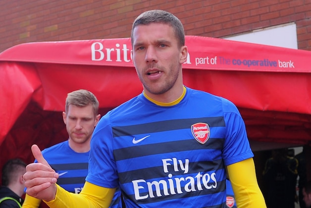STOKE ON TRENT, ENGLAND - MARCH 01:  Lukas Podolski of Arsenal walks out to warm up prior to the Barclays Pemier League match between Stoke City and Arsenal at the Britannia Stadium on March 1, 2014 in Stoke on Trent, England.  (Photo by Michael Regan/Getty Images)