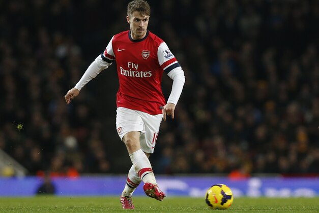 Arsenal's Aaron Ramsey plays against Hull City during their English Premier League soccer match at Emirates Stadium in London, Wednesday, Dec. 4, 2013. (AP Photo/Sang Tan)