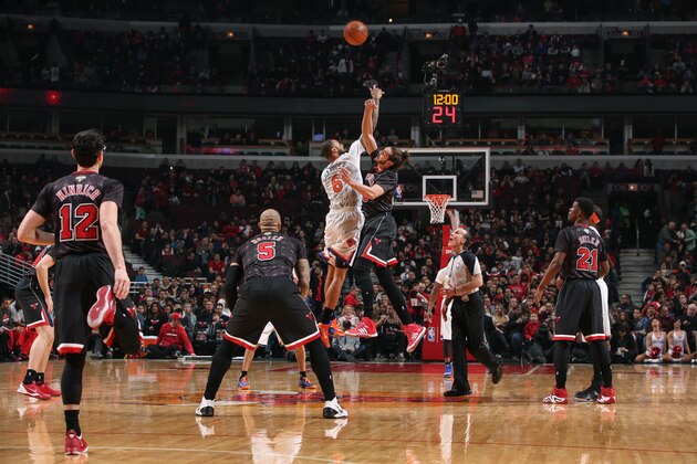 CHICAGO, IL - MARCH 2: Tyson Chandler #6 of the New York Knicks jumps for the tip-off against Joakim Noah #13 of the Chicago Bulls on March 02, 2014 at the United Center in Chicago, Illinois. NOTE TO USER: User expressly acknowledges and agrees that, by downloading and or using this Photograph, user is consenting to the terms and conditions of the Getty Images License Agreement. Mandatory Copyright Notice: Copyright 2013 NBAE (Photo by Gary Dineen/NBAE via Getty Images)