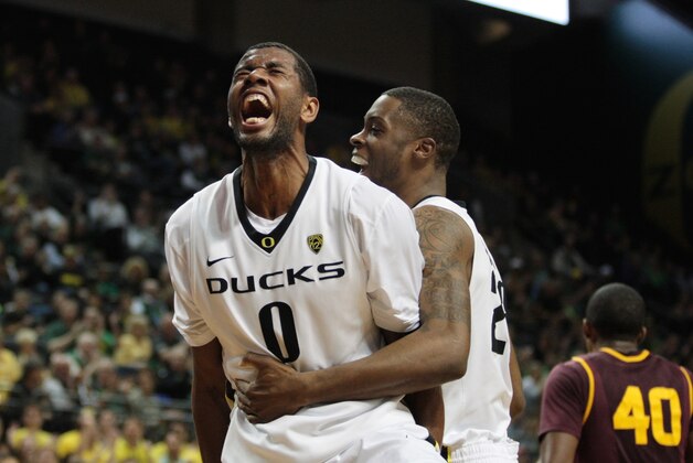 Mar 4, 2014; Eugene, OR, USA; Oregon Ducks forward Elgin Cook (23) celebrates with Oregon Ducks Mike Moser (0) following a shot from Oregon Ducks Mike Moser (0) against the Arizona State Sun Devils at Matthew Knight Arena. Mandatory Credit: Scott Olmos-USA TODAY Sports Mar 4, 2014; Eugene, OR, USA; Oregon Ducks forward Elgin Cook (23) celebrates with Oregon Ducks Mike Moser (0) following a shot from Oregon Ducks Mike Moser (0) against the Arizona State Sun Devils at Matthew Knight Arena. Mandatory Credit: Scott Olmos-USA TODAY Sports