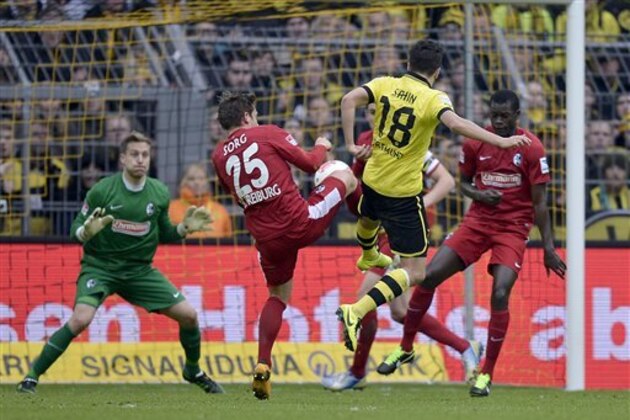 Dortmund's Nuri Sahin, 18, scores his second goal during the German first division Bundesliga soccer match between Borussia Dortmund and SC Freiburg in Dortmund, Germany, Saturday, March 16, 2013. (AP Photo/Martin Meissner)