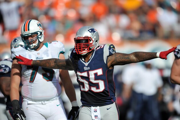 Dec 2, 2012;  Miami, FL, USA; New England Patriots middle linebacker Brandon Spikes (55) reacts in front of Miami Dolphins defensive end Derrick Shelby (79) during the second half at Sun Life Stadium. The  Patriots won 23-16. Mandatory Credit: Steve Mitchell-USA TODAY Sports