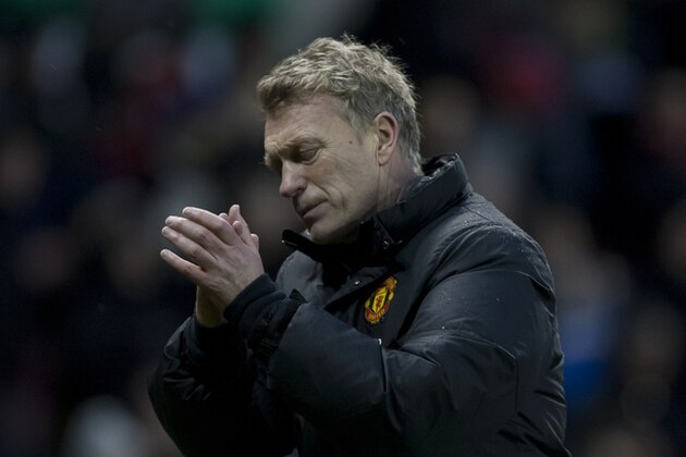 Manchester United's manager David Moyes applauds supporters after his team's 2-1 loss at Stoke in their English Premier League soccer match at the Britannia Stadium, Stoke, England, Saturday Feb. 1, 2014. (AP Photo/Jon Super)