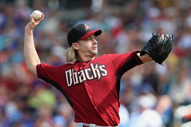 MESA, AZ - FEBRUARY 27:  Starting pitcher Bronson Arroyo #61 of the Arizona Diamondbacks pitches against the Chicago Cubs during the spring training game at Cubs Park on February 27, 2014 in Mesa, Arizona  (Photo by Christian Petersen/Getty Images)
