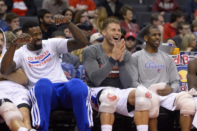 Los Angeles Clippers center DeAndre Jordan, left, forward Blake Griffin, center, and guard Chris Paul joke around on the bench during the second half of an NBA basketball game, Saturday, March 1, 2014, in Los Angeles. The Clippers won 108-76. (AP Photo/Mark J. Terrill)