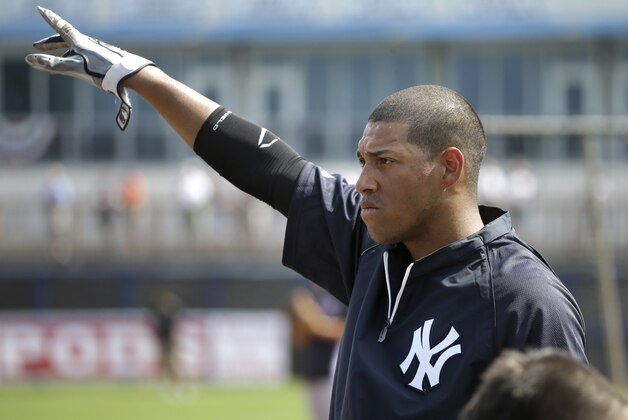 New York Yankees second baseman Yangervis Solarte works out on the field before an exhibition baseball game against the Tampa Bay Rays, Wednesday, March 5, 2014, in Port Charlotte, Fla. (AP Photo/Steven Senne)
