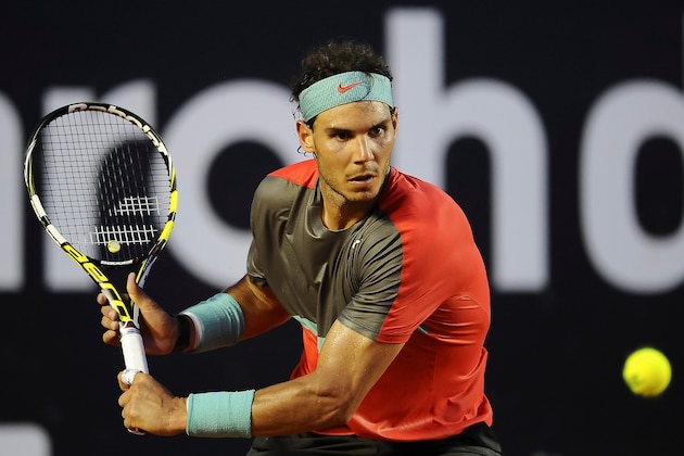 RIO DE JANEIRO, BRAZIL - FEBRUARY 23: Rafael Nadal of Spain returns the ball to Alexandr Dolgopolov of Ukraine during the ATP Rio Open 2014 at Jockey Club Rio de Janeiro on February 23, 2014 in Rio de Janeiro, Brazil. (Photo by Buda Mendes/Getty Images) RIO DE JANEIRO, BRAZIL - FEBRUARY 23: Rafael Nadal of Spain returns the ball to Alexandr Dolgopolov of Ukraine during the ATP Rio Open 2014 at Jockey Club Rio de Janeiro on February 23, 2014 in Rio de Janeiro, Brazil. (Photo by Buda Mendes/Getty Images)