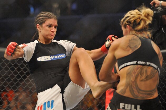 SAN JOSE, CA - AUGUST 15:  Cris Cyborg (R) battles Gina Carano during their Middleweight Championship fight at Stikeforce: Carano vs. Cyborg on August 15, 2009 in San Jose, California.  (Photo by Jon Kopaloff/Getty Images)