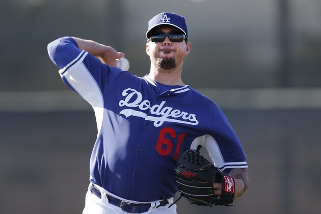 Los Angeles Dodgers pitcher Josh Beckett throws during spring training baseball practice Monday, Feb. 10, 2014, in Glendale, Ariz. (AP Photo/Paul Sancya) Los Angeles Dodgers pitcher Josh Beckett throws during spring training baseball practice Monday, Feb. 10, 2014, in Glendale, Ariz. (AP Photo/Paul Sancya)