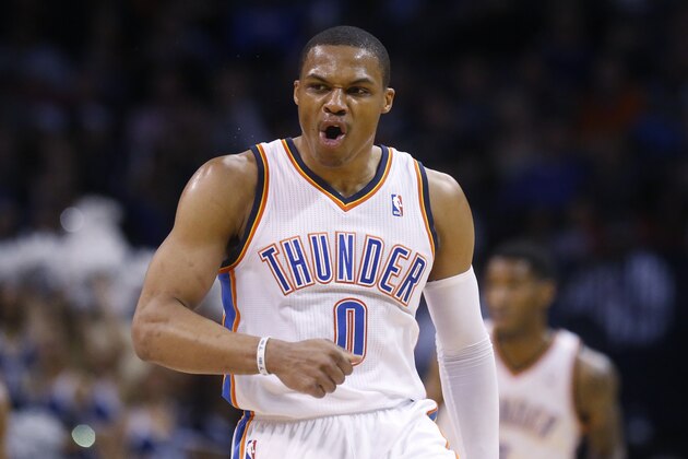 Oklahoma City Thunder guard Russell Westbrook (0) gestures following a three point basket in the second quarter of an NBA basketball game against the Philadelphia 76ers in Oklahoma City, Tuesday, March 4, 2014. (AP Photo/Sue Ogrocki)