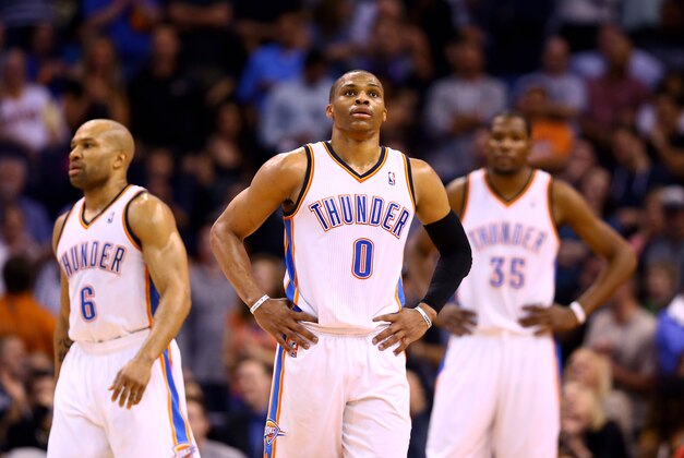 Mar 6, 2014; Phoenix, AZ, USA; Oklahoma City Thunder guard Russell Westbrook (0), guard Derek Fisher (6) and forward Kevin Durant react in the fourth quarter against the Phoenix Suns at the US Airways Center. The Suns defeated the Thunder 128-122. Mandatory Credit: Mark J. Rebilas-USA TODAY Sports