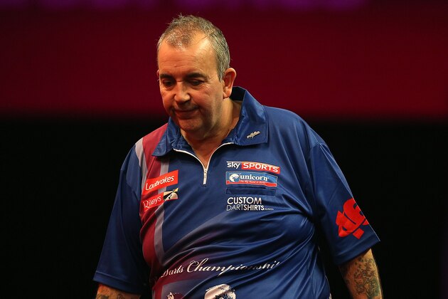 LONDON, ENGLAND - DECEMBER 20: Phil Taylor of England reacts during his second round match against Michael Smith of England during the Ladbrokes.com World Darts Championship on Day Eight at Alexandra Palace on December 20, 2013 in London, England. (Photo by Charlie Crowhurst/Getty Images)