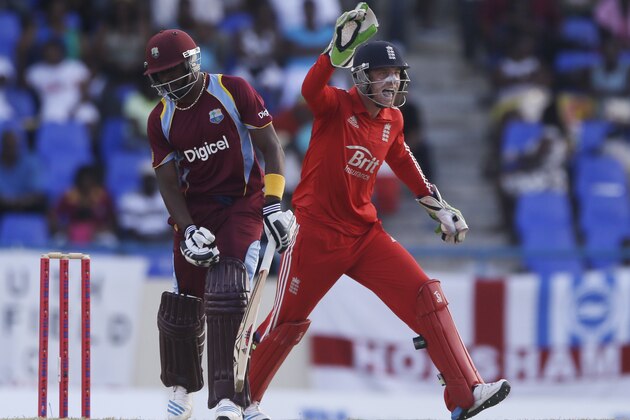 England's wicketkeeper Jos Buttler celebrates the dismissal of West Indies' Dwayne Bravo during their third one-day international cricket match at the Sir Vivian Richards Cricket Ground in St. John's, Antigua, Wednesday, March 5, 2014. (AP Photo/Ricardo Mazalan)