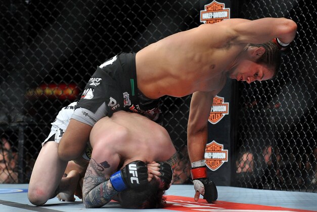 April 13, 2013; Las Vegas, NV, USA; Urijah Faber lands an elbow on Scott Jorgensen during the TUF 17 Finale at the Mandalay Bay Events Center. Mandatory Credit: Gary A. Vasquez-USA TODAY Sports